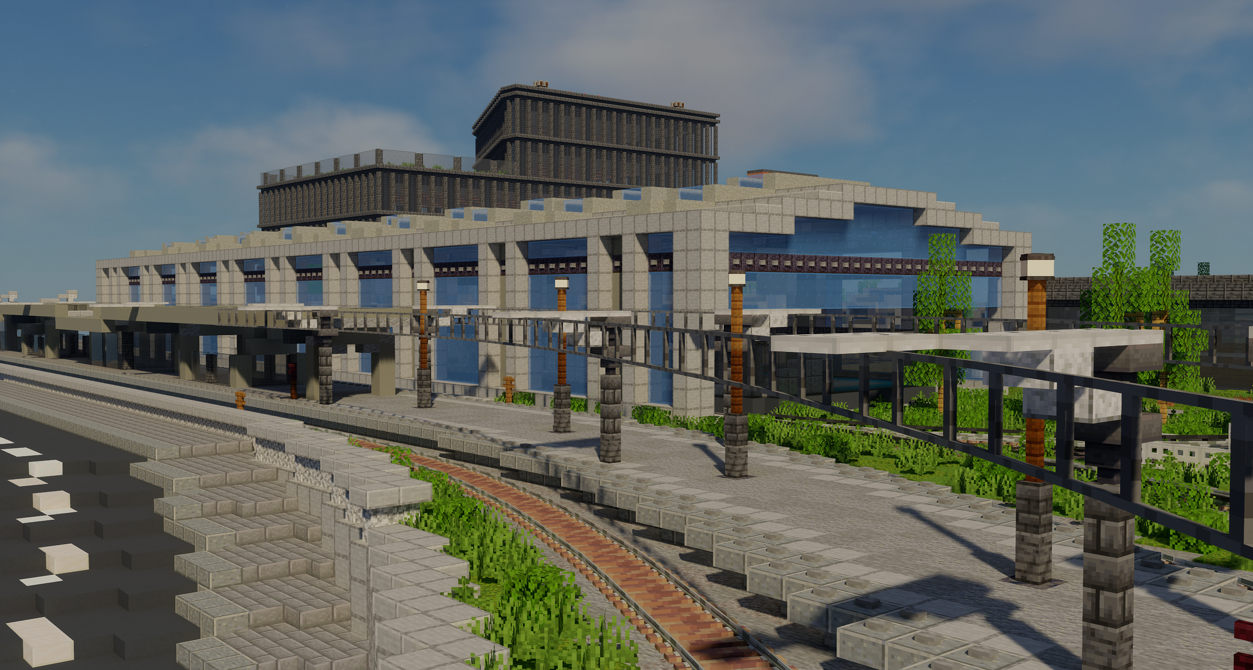 An image of Seaporte Junction's ECML platforms, with the main station building visible behind, surrounded by a few tall buildings.