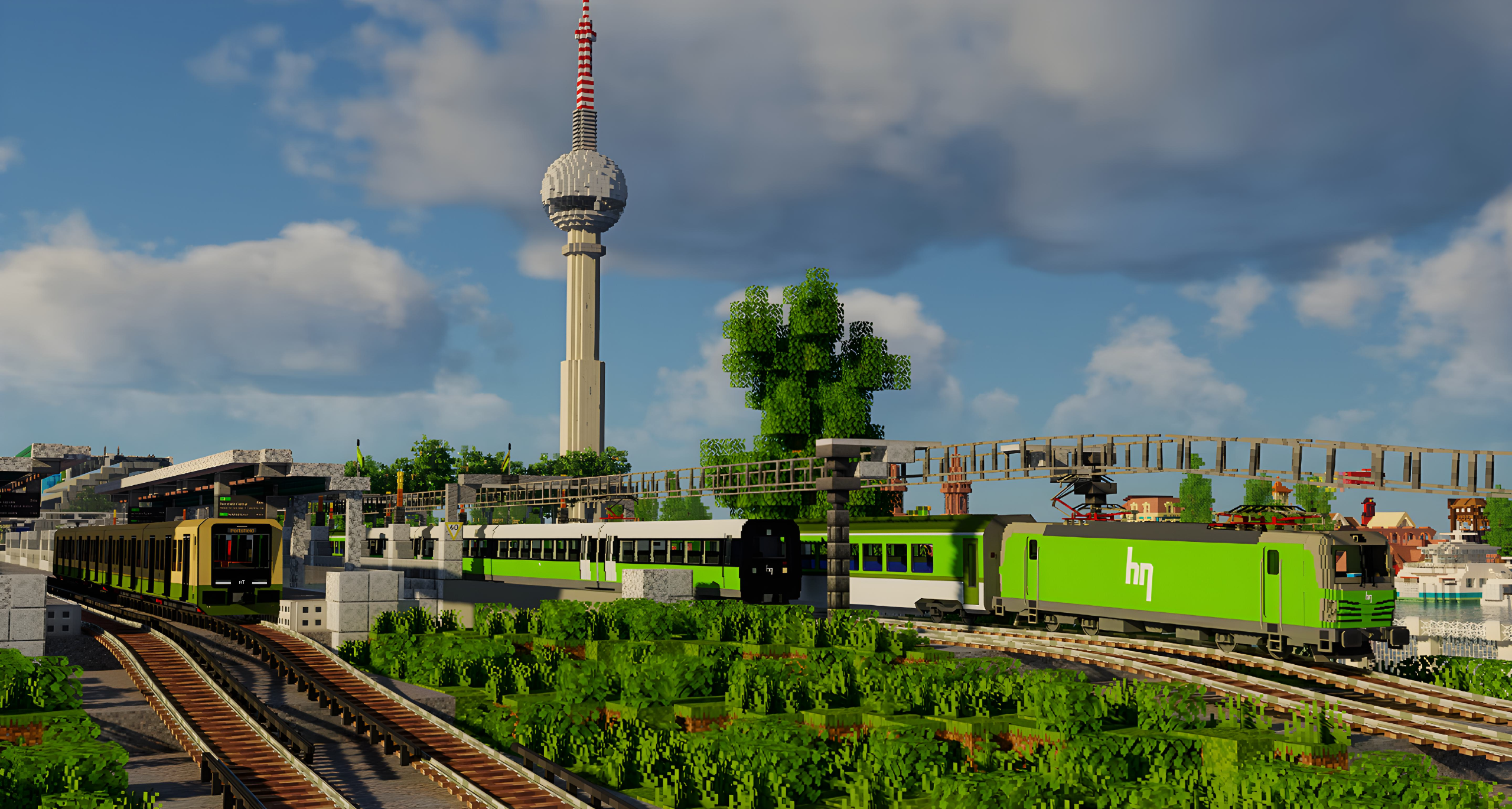 An image of a HN Vectron locomotive-hauled train, an IR4 train and a Commuter train, with the Harlon TV Tower visible in the background.